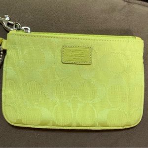 Coach Wristlet with Signature C Coach Canvas in Neon green/yellow